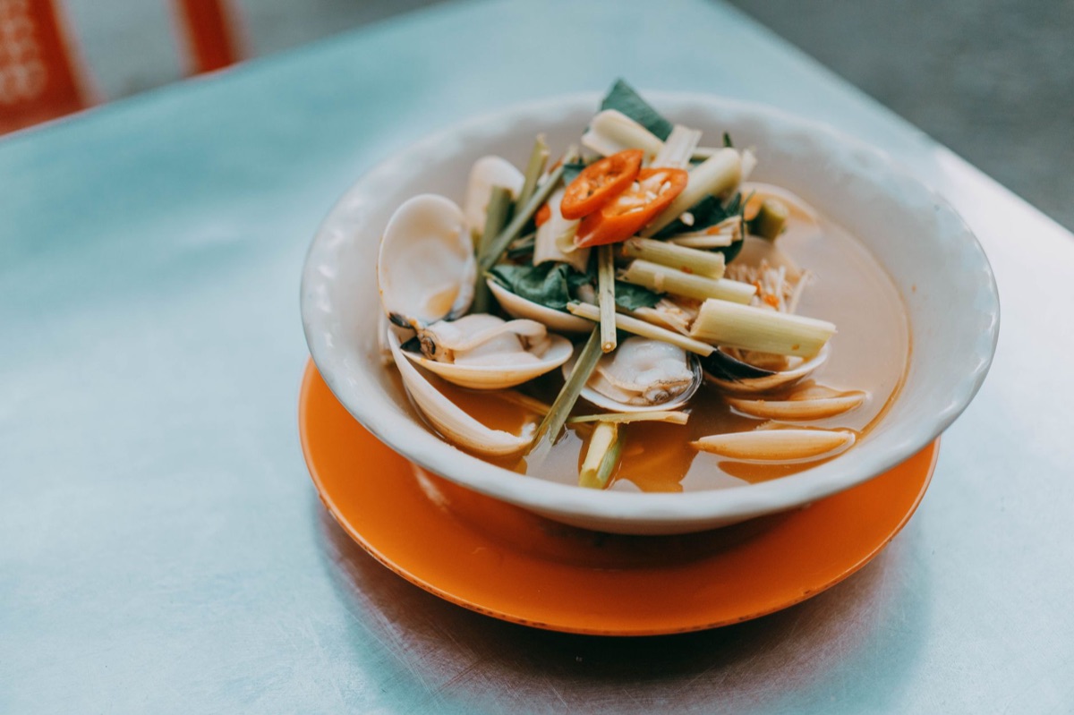 Clam chowder bowl in wooden kitchen